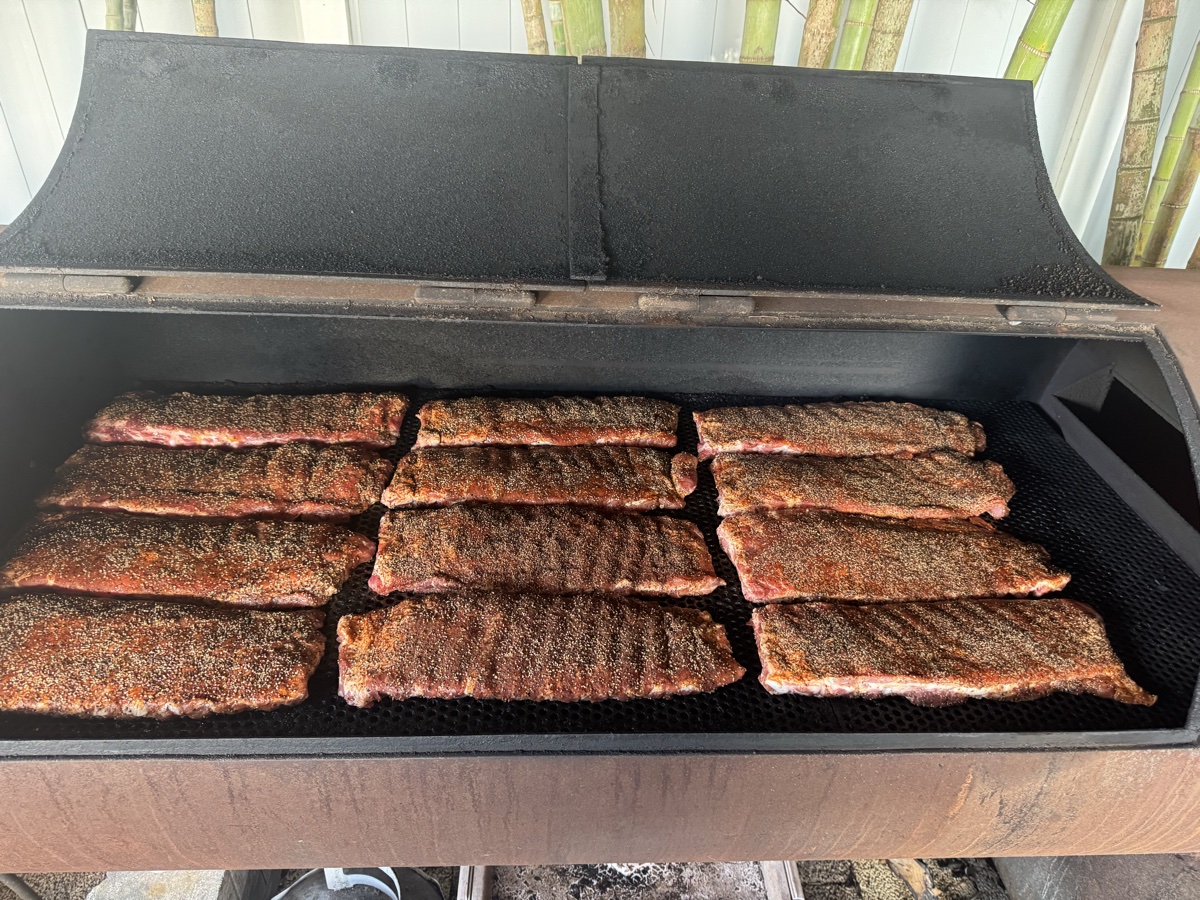 Racks of ribs smoking on the pit