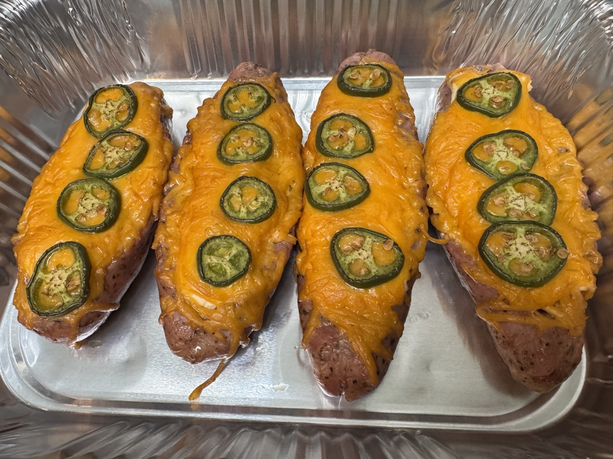Loaded sausage boats with cheese and jalapeños